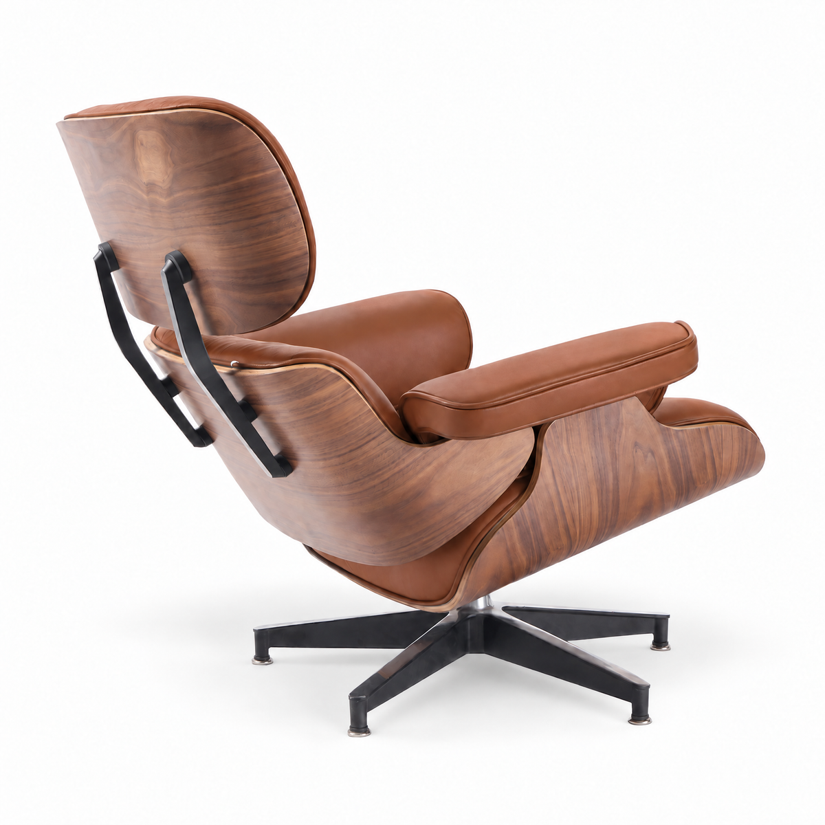 Mid-century lounge chair in cognac brown leather with walnut veneer, rear three-quarter view