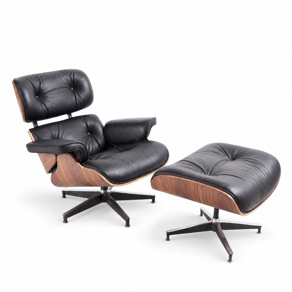 Mid-century lounge chair and ottoman in black full-grain leather with walnut veneer, front three-quarter view