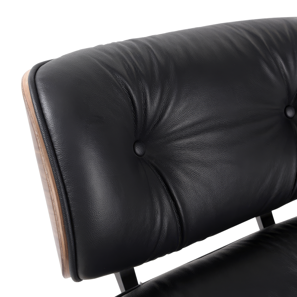 Headrest close-up of a mid-century lounge chair in black leather with walnut veneer