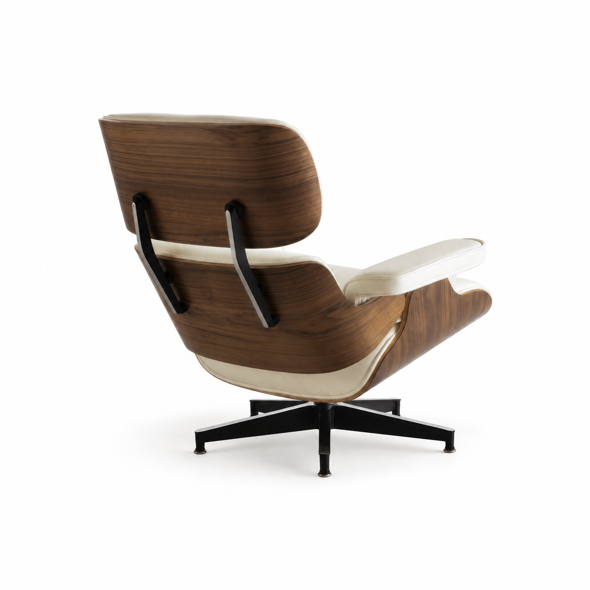 Mid-century lounge chair in cream leather with walnut veneer, rear three-quarter view